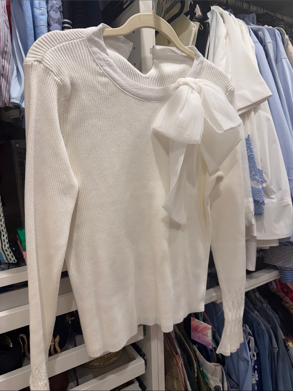 Elegant White Ribbed Knit Sweater with Bow Accent and accented sleeves